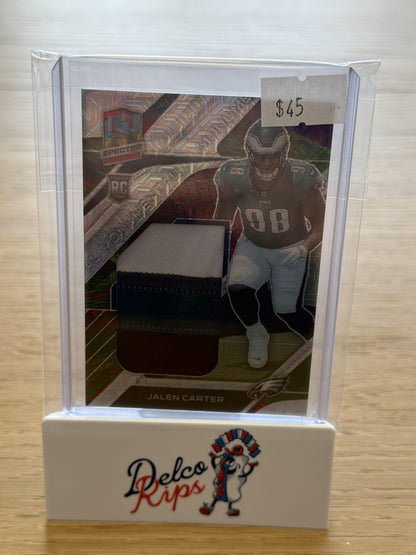 2023 Panini Spectra #MME-JAC Jalen Carter Monumental Memorabilia Meta #/25