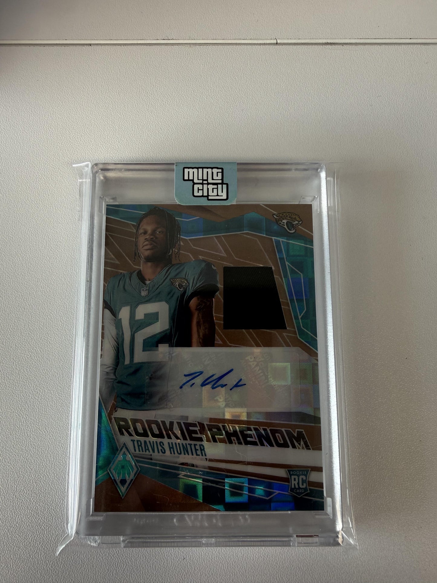 2025 Panini Phoenix #RPJ-THR Travis Hunter RPA Bronze Pandora Prizm #/199