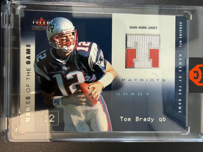 2002 Fleer Genuine #TB-NG Tom Brady Names of the Game Jerseys #/500